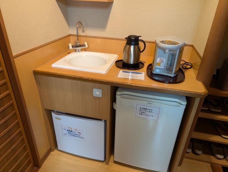 Simple but sufficient amenities like a refrigerator and kettle