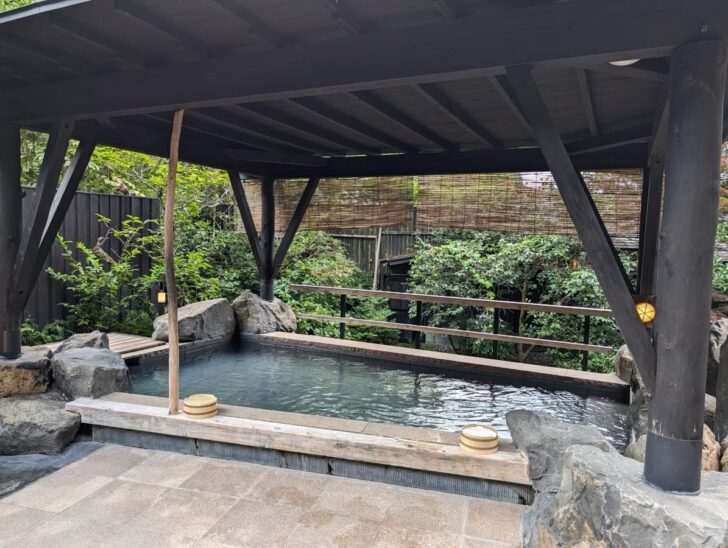 Soaking in the open-air bath surrounded by greenery