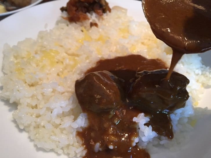 I carefully poured the curry onto the rice and took my first bite