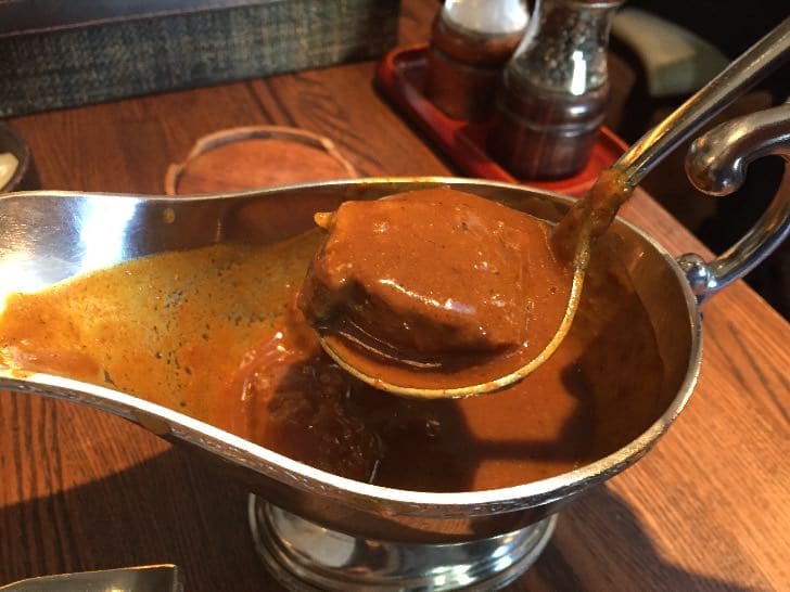 The thick, velvety curry sauce was studded with large chunks of tender beef