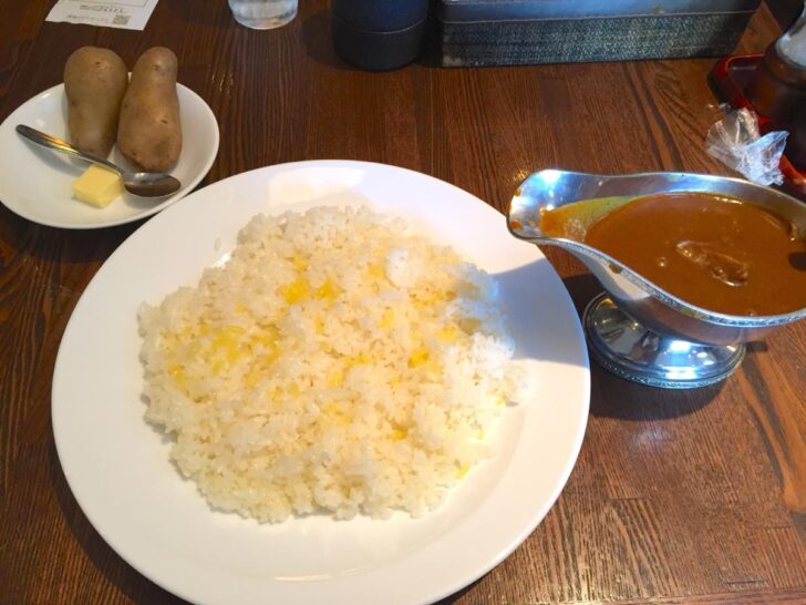 a luxurious beef curry paired with the classic side of steamed potatoes