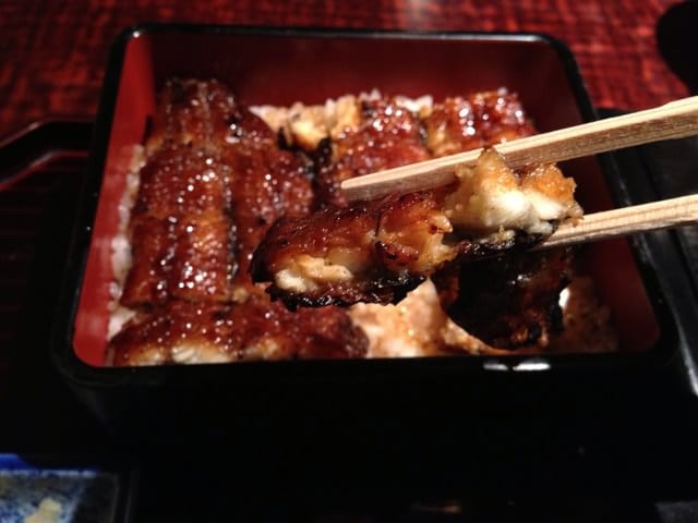 Enjoying every bite of the grilled eel