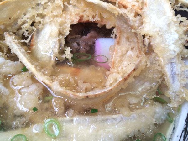 Enjoying crispy and soaked goboten in broth