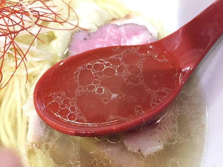 Aromatic chicken broth at Menya Sho