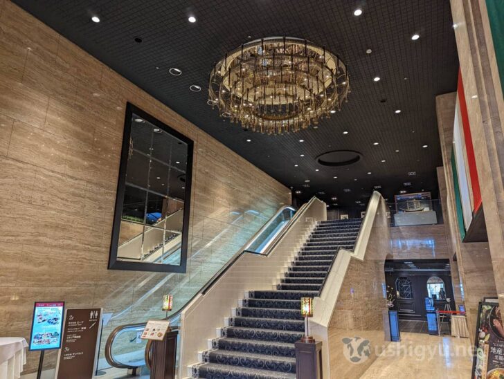 Inside, a large chandelier and high ceiling welcome visitors