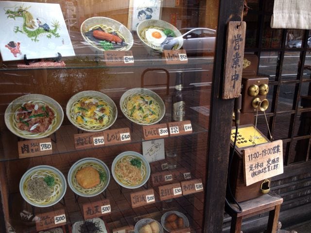 Vintage-looking menu board at Karono Uron