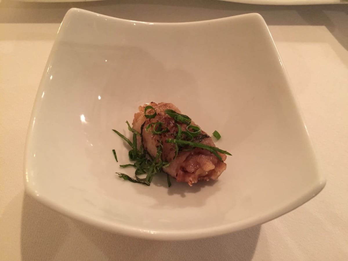 Bite-sized meat-wrapped rice balls as an appetizer