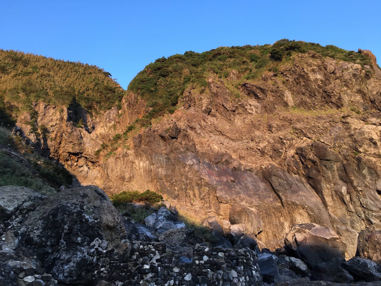 Steep cliffs on the opposite side from the ocean