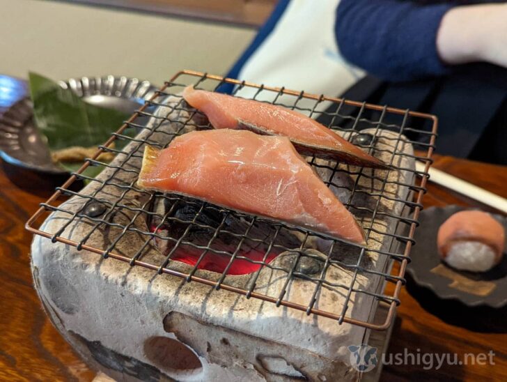 Traditional salt-cured salmon grilled over charcoal