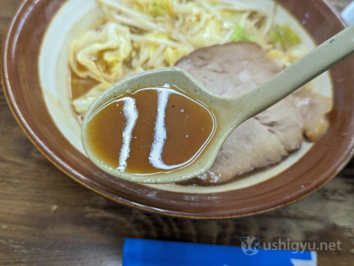 Taking a sip of the rich-looking soup