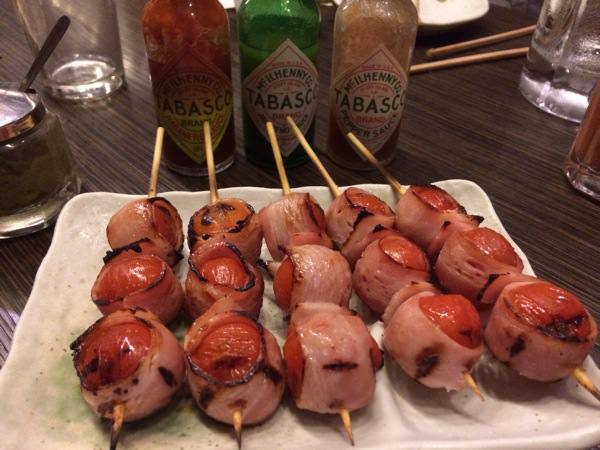 Bacon-wrapped tomato with three types of Tabasco available