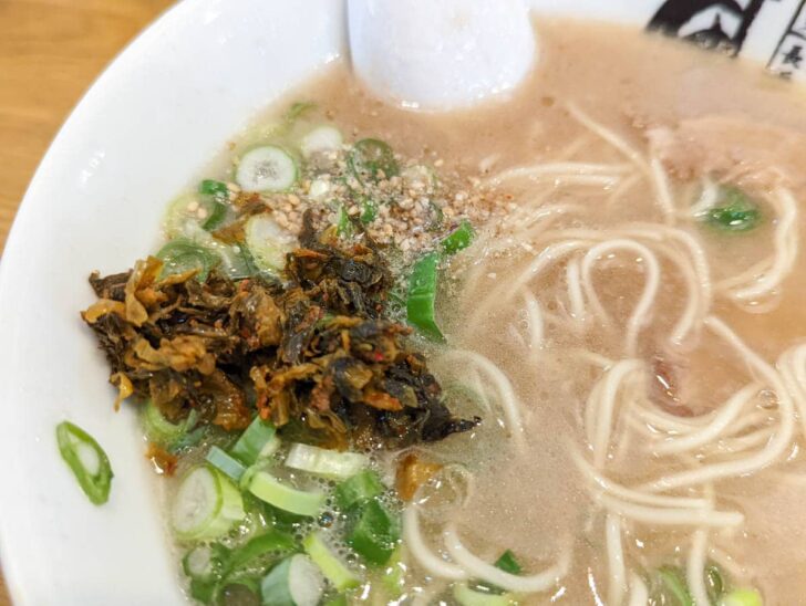 The spicy pickled mustard greens on the table are also something you don't want to miss
