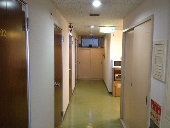 Hotel room key and hallway