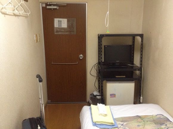 TV and refrigerator in room