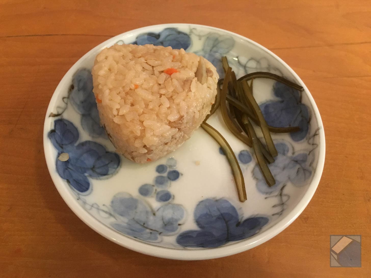 Pre-made chicken rice balls on a lacquer tray