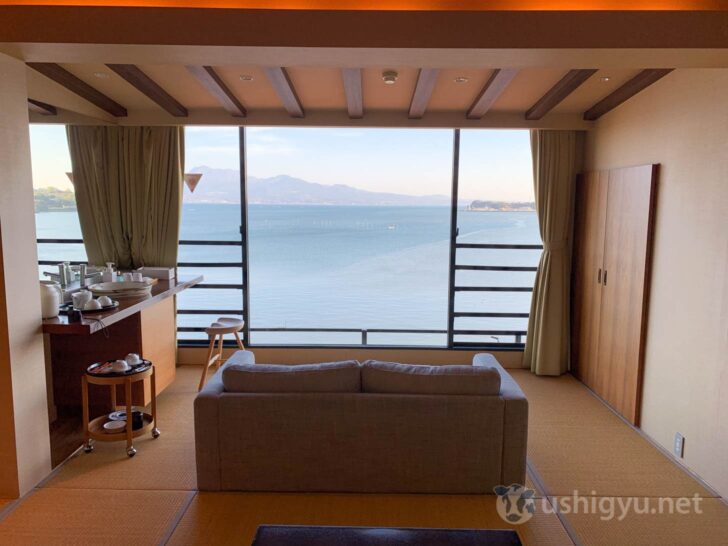 Ocean-view guest room with sofa facing the sea