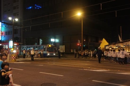 Trains and traffic giving way to procession