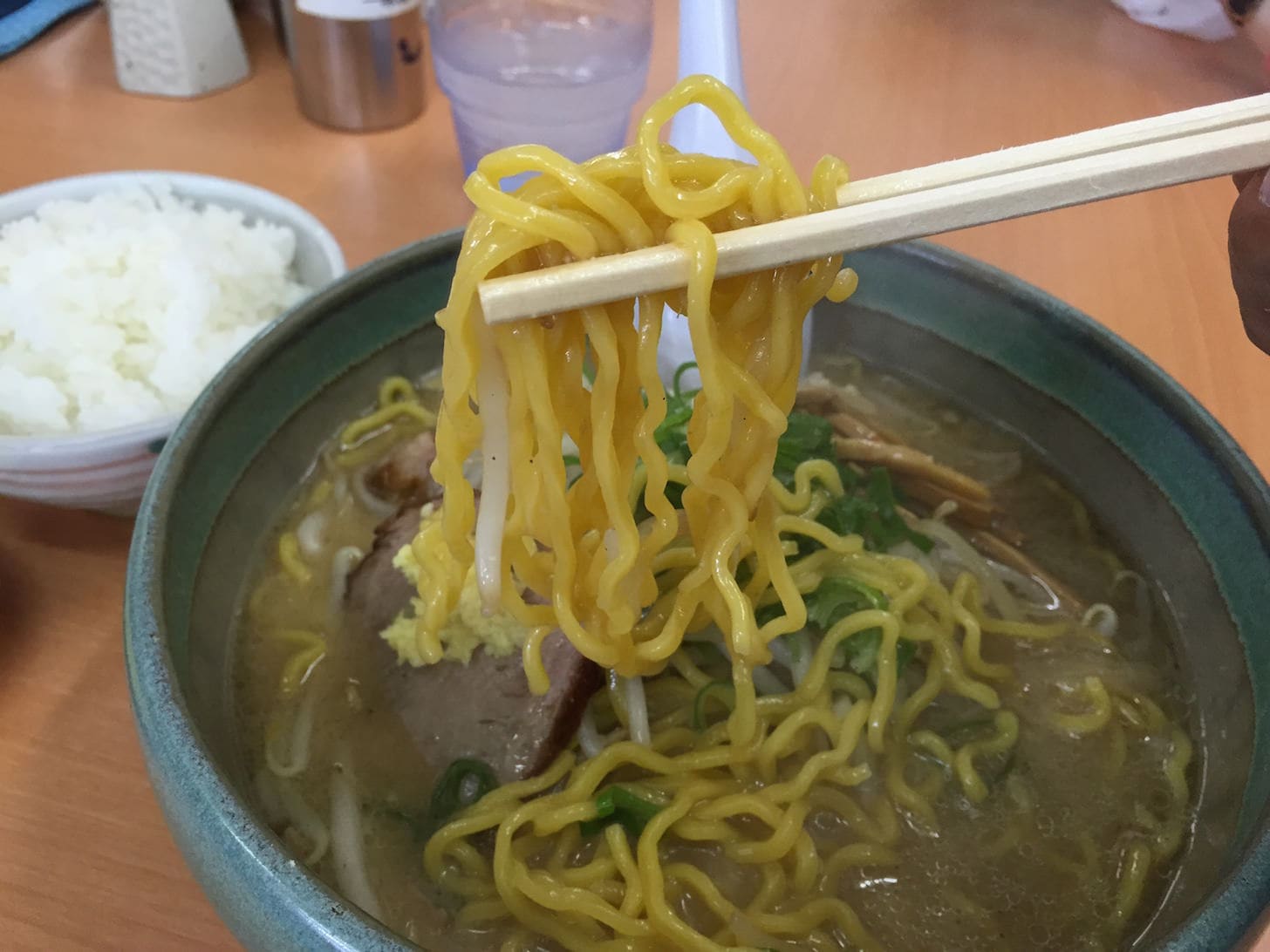 Curly egg noodles intertwined with rich soup
