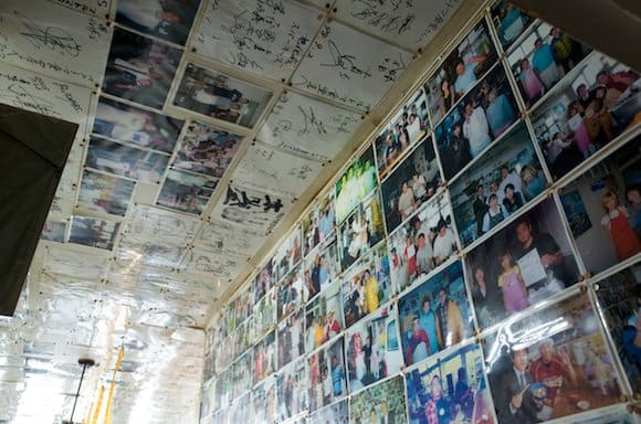 Walls lined with celebrity photos and autographs