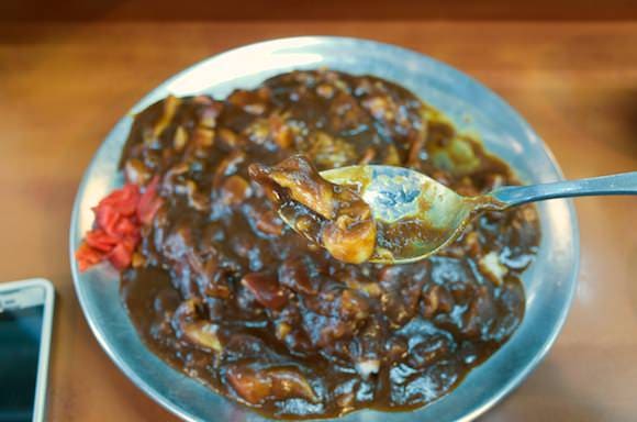 Close-up of Hokkigai in curry sauce