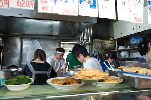 Kitchen staff preparing seafood