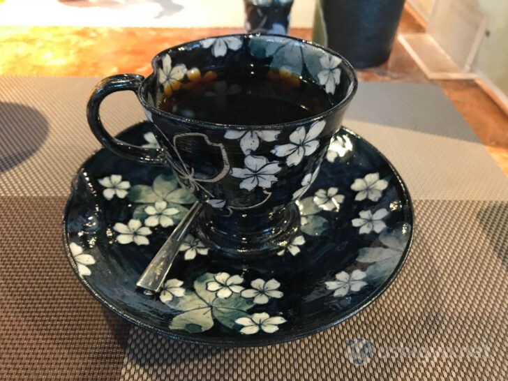 Stylish black coffee cup with elegant design