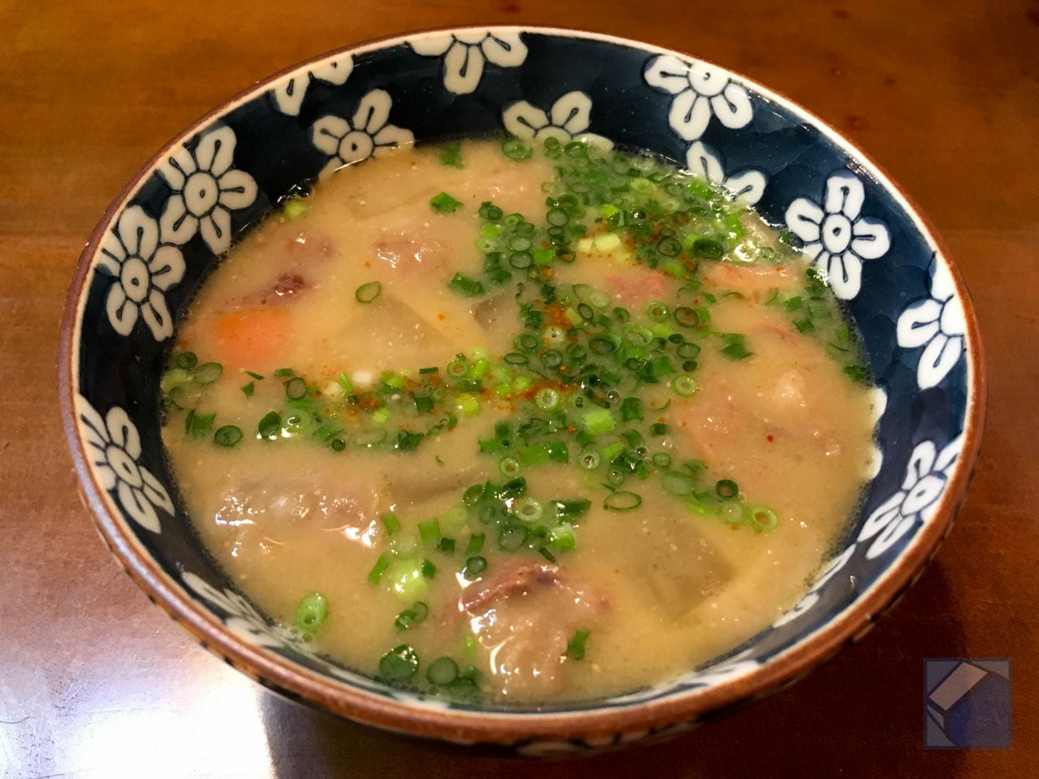 Bowl of bajiru horse meat soup with vegetables