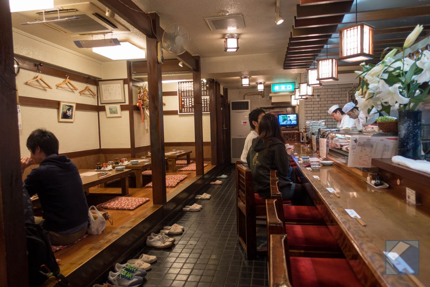 Interior of Mutsugoro restaurant with counter seating