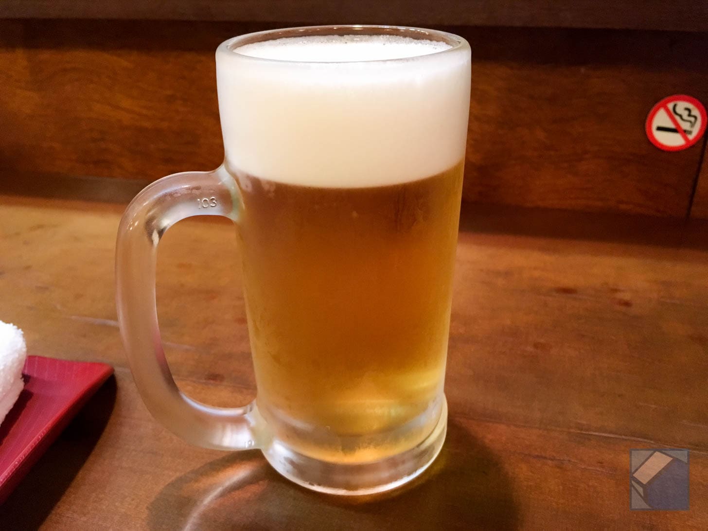 Frosted beer mug filled with cold beer