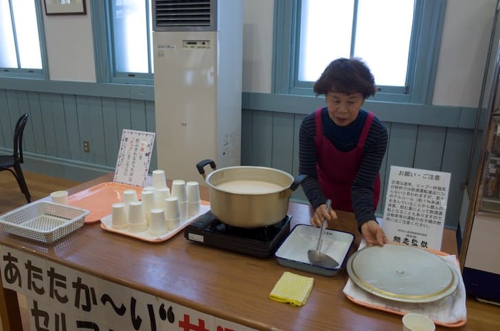 Woman serving amazake