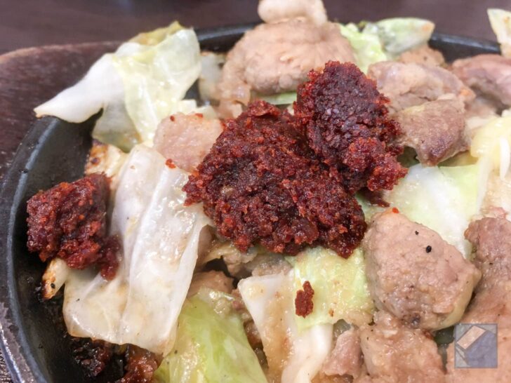 Adding spicy miso to grilled meat