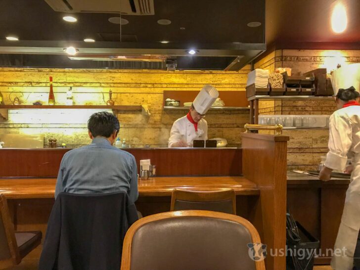 Chef cooking at counter while you wait