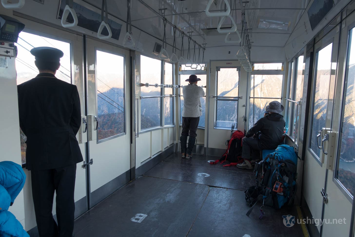 Ropeway ascending over autumn mountains