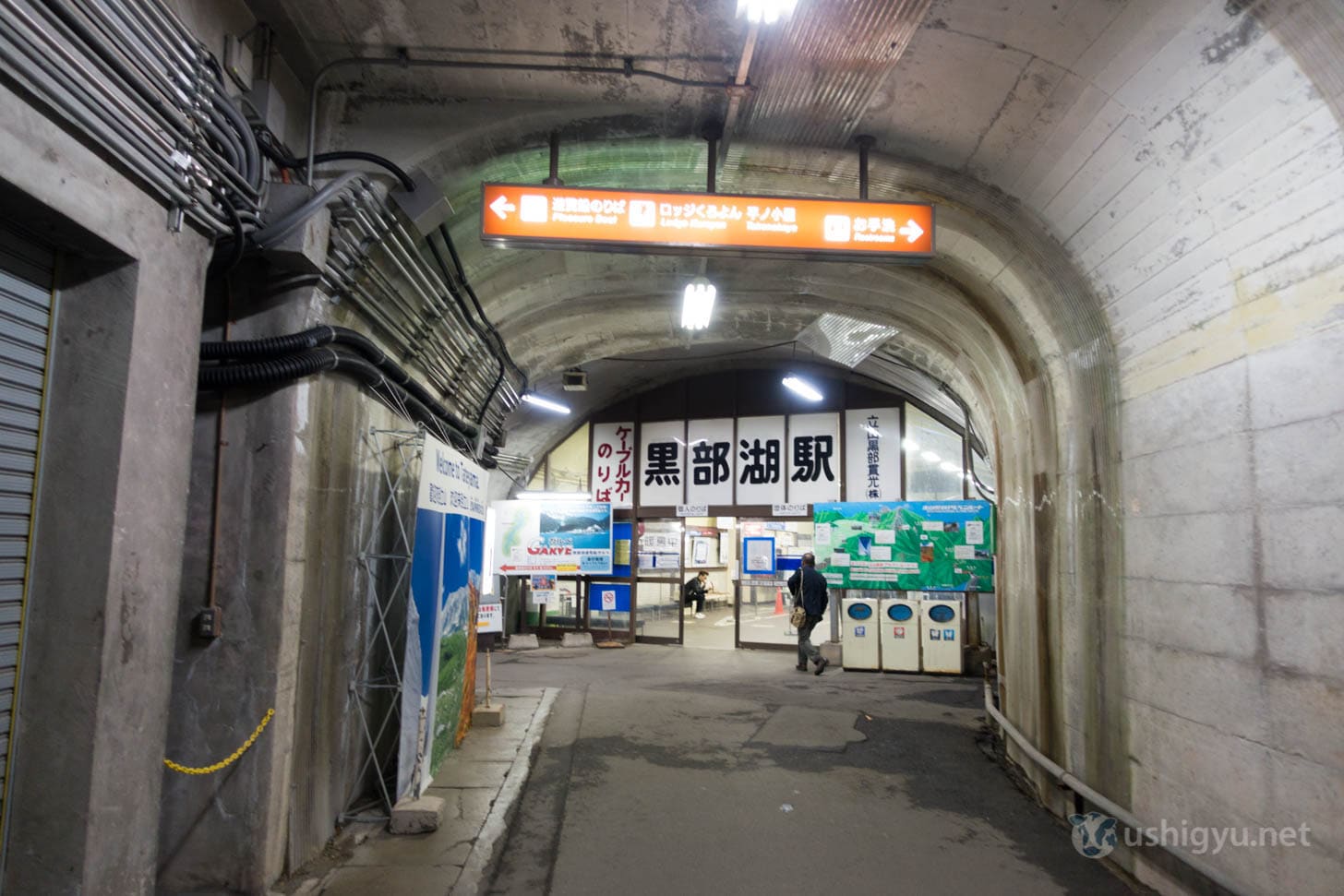 Trolley bus approaching Kurobe Dam on sunny morning
