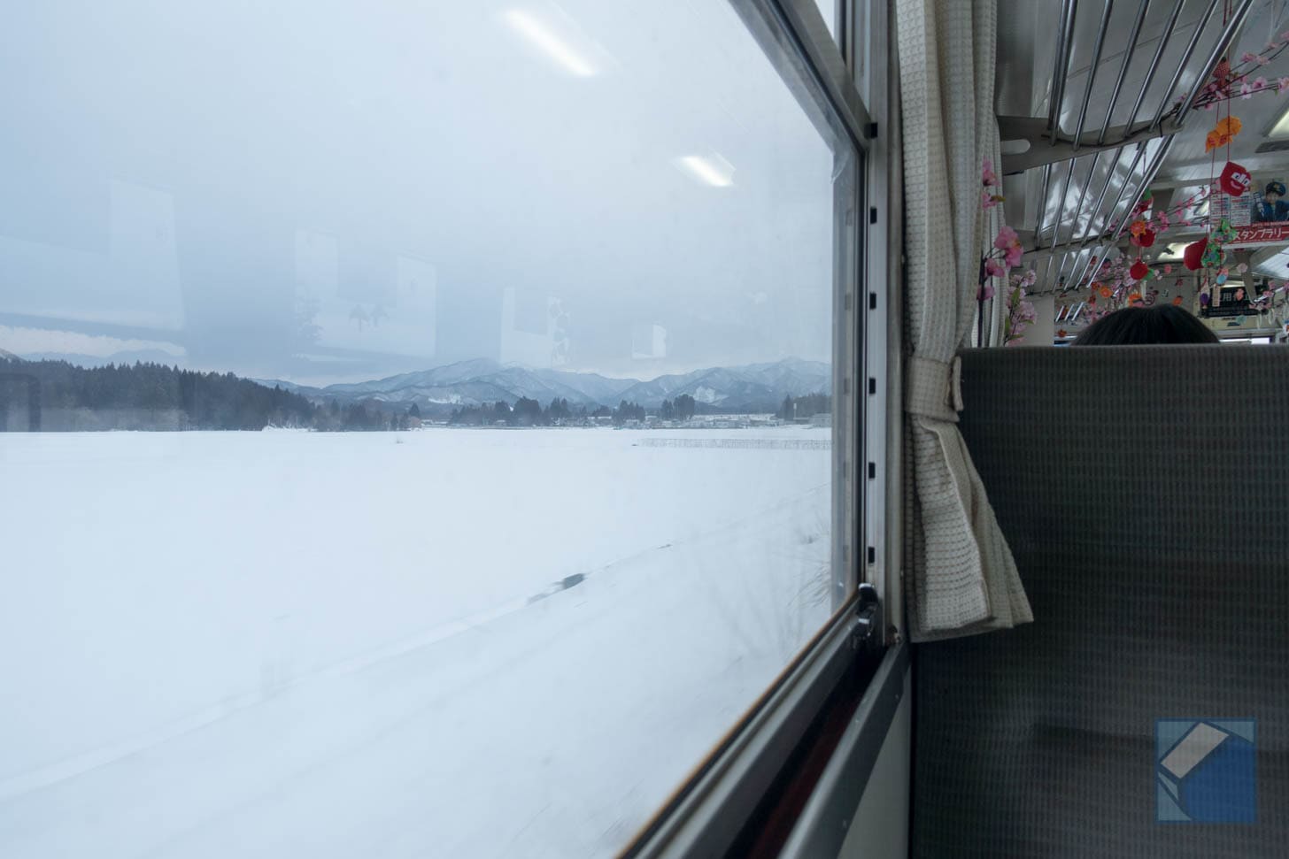 View from train with decreasing buildings
