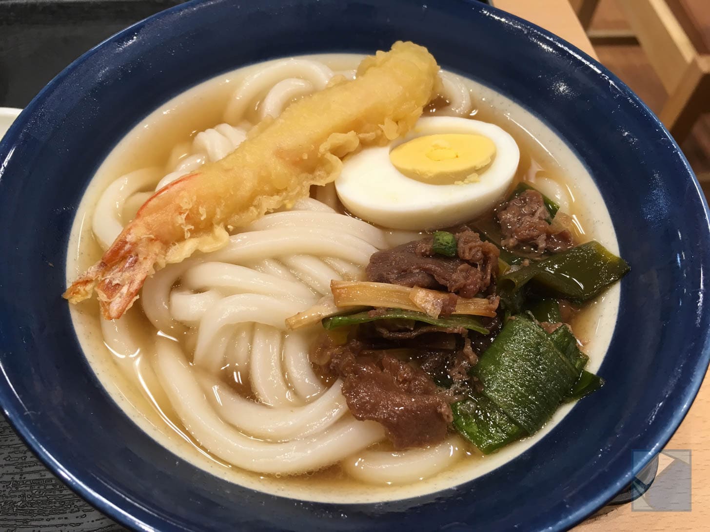 Mini udon with toppings including fried shrimp and egg