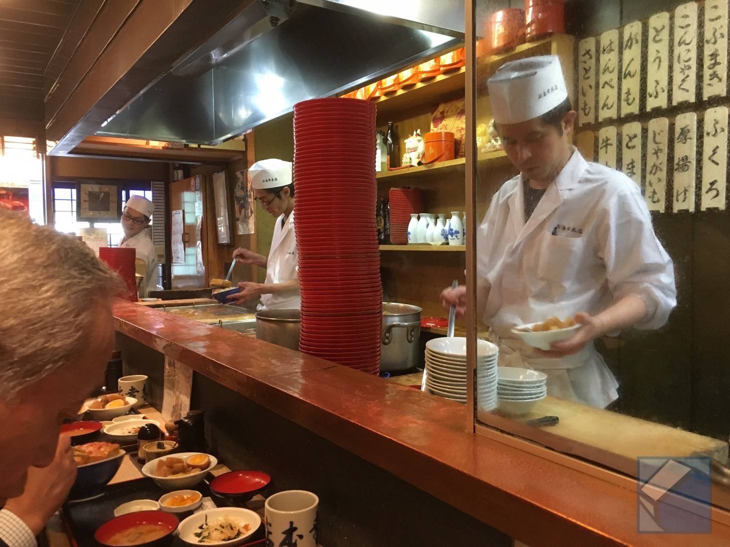 Interior with chef and counter seating
