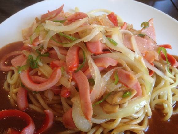 Close-up of toppings with red sausages